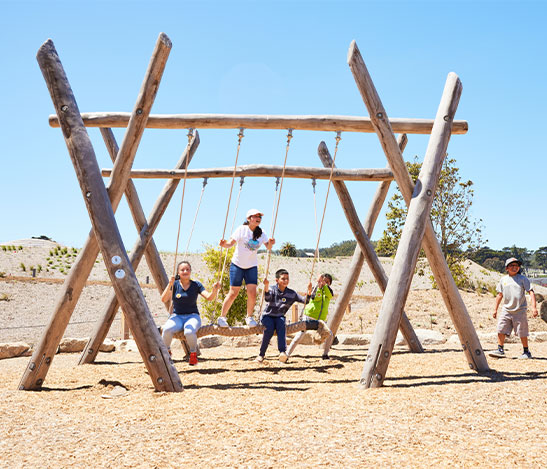 People on swings at Presidio Tunnel Tops Outpost