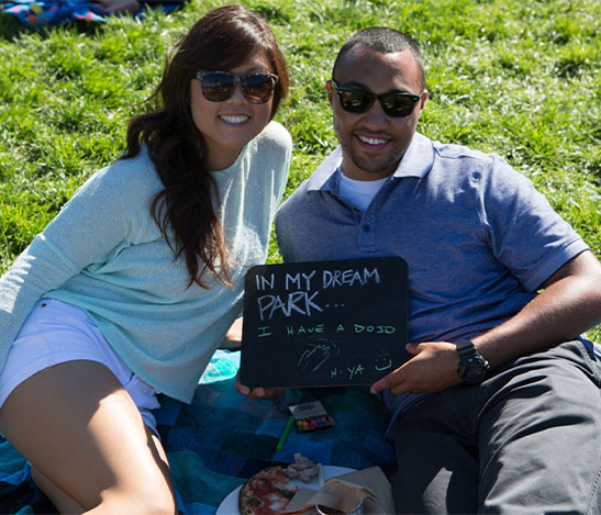 Couple holding a board In My Dream Park... I have a DOJO