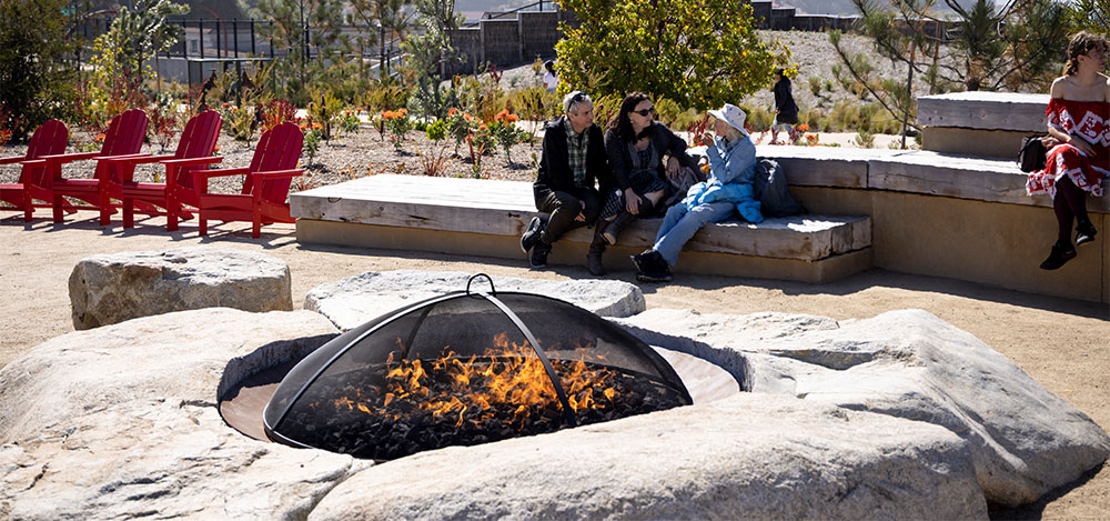 Visitors sitting around Campfire Circle